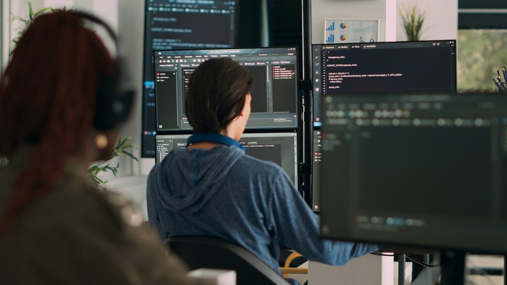 Specialist at a computer reviewing online casino software during a brand's first months