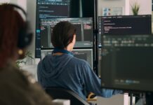 The First 90 Days: Running a New Casino After Launch Specialist at a computer reviewing online casino software during a brand's first months